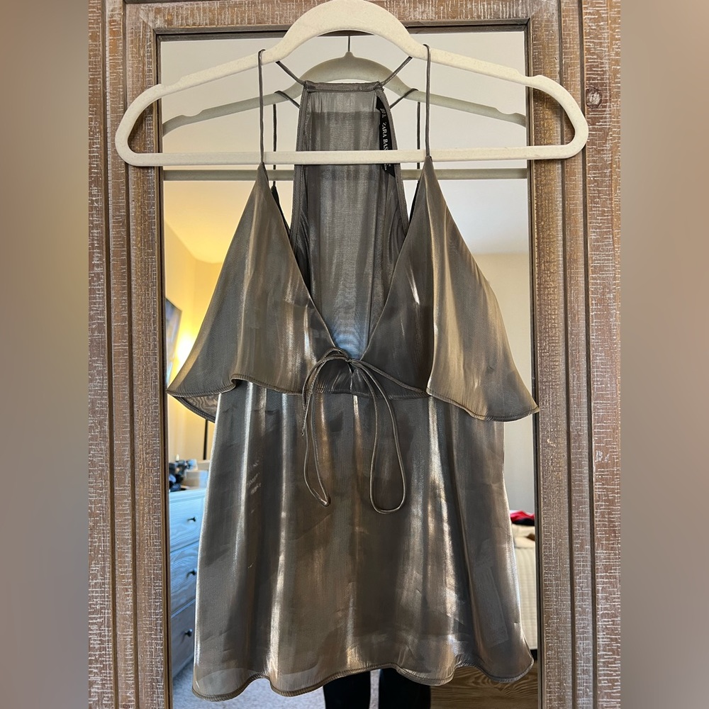 Silver sheer-like material blouse. Size S.